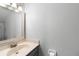 Simple bathroom with a sink, mirror, and minimal wall decor at 402 E Orlando Ave # 18C, Ocoee, FL 34761