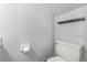 Clean bathroom featuring a standard toilet, textured walls, and a sleek towel bar at 402 E Orlando Ave # 18C, Ocoee, FL 34761