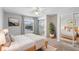 Bright bedroom with light wood floors, a comfy bed, and ample closet space at 402 E Orlando Ave # 18C, Ocoee, FL 34761