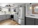 Modern kitchen featuring stainless steel appliances, light countertops, and sleek gray cabinetry at 402 E Orlando Ave # 18C, Ocoee, FL 34761