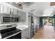 Updated kitchen features a breakfast bar with open access to the living room at 402 E Orlando Ave # 18C, Ocoee, FL 34761