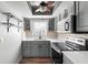 Cozy kitchen featuring updated appliances, cabinets, and countertop at 402 E Orlando Ave # 18C, Ocoee, FL 34761
