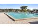 Community swimming pool surrounded by lounge chairs and lush landscaping at 402 E Orlando Ave # 18C, Ocoee, FL 34761