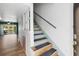 Open-concept entry with staircase leading to the upper level and views of the lake at 402 E Orlando Ave # 18C, Ocoee, FL 34761