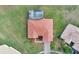 Straight down view of a single-Gathering home featuring a terracotta tile roof, screened-in pool and well-manicured lawn at 4036 Bougainvillea Pl, Kissimmee, FL 34746