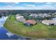 A single-Gathering home features a screened-in pool, terracotta tile roof, and backyard bordering a canal at 4036 Bougainvillea Pl, Kissimmee, FL 34746