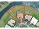 Overhead view of a tile roof house highlighting its screened-in pool and manicured lawn near a quiet cul-de-sac at 4036 Bougainvillea Pl, Kissimmee, FL 34746