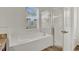 Bathroom with a white tub and shower at 4036 Bougainvillea Pl, Kissimmee, FL 34746