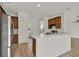 Kitchen featuring modern appliances, ample cabinetry, and a breakfast bar at 4036 Bougainvillea Pl, Kissimmee, FL 34746