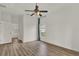 Minimalist bedroom with hardwood floors and a view of the yard at 4036 Bougainvillea Pl, Kissimmee, FL 34746