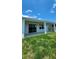 Backyard with large sliding door and a covered patio at 4110 Gooseberry Trl, Kissimmee, FL 34746