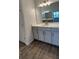 Bathroom featuring double vanity, quartz countertop and chrome faucet at 4110 Gooseberry Trl, Kissimmee, FL 34746