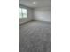 A spacious bedroom with plush carpeting and natural light at 4110 Gooseberry Trl, Kissimmee, FL 34746