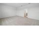 Spacious bedroom with neutral carpeting and an open doorway leading to the bathroom at 4110 Gooseberry Trl, Kissimmee, FL 34746