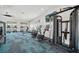 Modern fitness center featuring stationary bikes, weight machines, and bright airy windows at 4110 Gooseberry Trl, Kissimmee, FL 34746