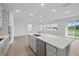 Bright, open-concept kitchen with a large island, stainless steel appliances, and ample natural light at 4110 Gooseberry Trl, Kissimmee, FL 34746