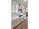 Bright kitchen with stainless steel appliances, sleek cabinets, and stylish backsplash at 4110 Gooseberry Trl, Kissimmee, FL 34746