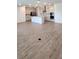 Open concept kitchen and living room with plenty of light at 4110 Gooseberry Trl, Kissimmee, FL 34746