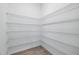 Walk-in closet with wire shelving offering ample storage space and organization at 4110 Gooseberry Trl, Kissimmee, FL 34746