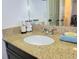 Bathroom vanity with a white sink, granite countertop and chrome faucet at 4304 Clubside Dr # 4304, Longwood, FL 32779