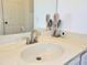 Well-lit bathroom featuring a pristine white sink and stylish countertop at 4304 Clubside Dr # 4304, Longwood, FL 32779