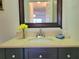 A lovely bathroom vanity showcasing a countertop sink and framed mirror at 4304 Clubside Dr # 4304, Longwood, FL 32779