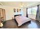 Relaxing bedroom with a ceiling fan, neutral walls, and a serene window view at 4304 Clubside Dr # 4304, Longwood, FL 32779