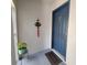 Condo entrance with a blue door, door mat, and a plant on a stand to welcome guests at 4304 Clubside Dr # 4304, Longwood, FL 32779
