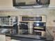 Modern kitchen features stainless steel appliances and sleek black cooktop at 4304 Clubside Dr # 4304, Longwood, FL 32779
