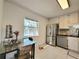 Bright kitchen with modern appliances, a breakfast nook, and a window with a pool view at 4304 Clubside Dr # 4304, Longwood, FL 32779