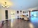 Spacious living room featuring hard wood floors, a ceiling fan, and sliding glass doors at 4304 Clubside Dr # 4304, Longwood, FL 32779