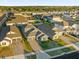 Aerial view of the community with a neatly arranged neighborhood layout and diverse home styles at 4472 Lions Gate Ave, Clermont, FL 34711