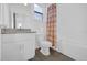 Bright bathroom featuring a granite vanity, subway tile shower, and modern fixtures at 4472 Lions Gate Ave, Clermont, FL 34711