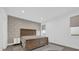 Neutral primary bedroom with a wood bed frame, accent wall, and a comfortable layout at 4472 Lions Gate Ave, Clermont, FL 34711