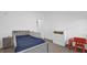 Charming bedroom with bed, blue bedding, dresser, and ' furniture at 4472 Lions Gate Ave, Clermont, FL 34711