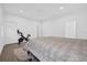 Spacious bedroom with exercise equipment and a neutral color scheme at 4472 Lions Gate Ave, Clermont, FL 34711