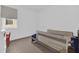 Bright bedroom featuring a window, grey floors, and a toddler bed at 4472 Lions Gate Ave, Clermont, FL 34711