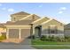 Charming two-story home with a two-car garage and beautifully landscaped front yard at 4472 Lions Gate Ave, Clermont, FL 34711