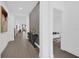 Bright hallway featuring modern decor and beautiful tile flooring throughout the home at 4472 Lions Gate Ave, Clermont, FL 34711