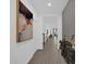 Bright hallway featuring modern decor and beautiful tile flooring throughout the home at 4472 Lions Gate Ave, Clermont, FL 34711