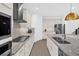 Bright kitchen featuring stainless steel appliances, granite countertops, and tile backsplash at 4472 Lions Gate Ave, Clermont, FL 34711
