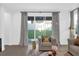 Cozy living room nook with plush seating and a view of the backyard at 4472 Lions Gate Ave, Clermont, FL 34711