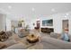 Open concept living room with modern finishes flowing into the kitchen and dining areas at 4472 Lions Gate Ave, Clermont, FL 34711
