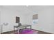 Bright office space with an elegant desk, purple rug, and a large window at 4472 Lions Gate Ave, Clermont, FL 34711