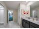 Well-lit bathroom with double vanity, modern fixtures, and stylish tile flooring at 4532 Target Blvd, Kissimmee, FL 34746