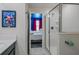 Chic bathroom with a glass-enclosed shower, modern fixtures, and access to a themed bedroom, offering convenience and style at 4532 Target Blvd, Kissimmee, FL 34746