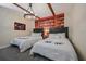 The bedroom features two beds, a bookshelf mural, and a unique chandelier at 4532 Target Blvd, Kissimmee, FL 34746