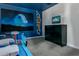 This Star Wars themed bedroom features a large mural and a flat-screen TV at 4532 Target Blvd, Kissimmee, FL 34746