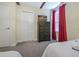 A well-lit bedroom with a large closet, dresser, and comfortable bed at 4532 Target Blvd, Kissimmee, FL 34746