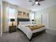 Comfortable bedroom featuring soft lighting, bedside lamps, and decorative wall art at 4532 Target Blvd, Kissimmee, FL 34746